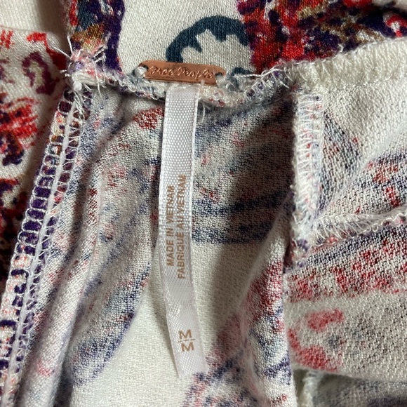 Boho and Gypsy style dress by Free People. Has an open back and elastic sleeves. - Picture 6 of 6